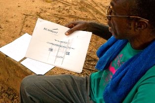 Akayema reading a plan